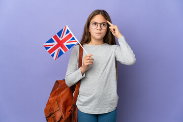 Poster - Child holding an United Kingdom flag over isolated background having doubts and thinking