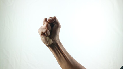 Counting, aggression, brave concept. Black male fist, clenched hand, strong male man raised fist power, protest, fist ready to fight isolated on white background.