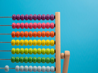 Wooden abacus on a blue background, Wooden abacus for children. Wooden abacus close-up.