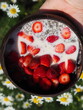 Owsianka chia z truskawkami Oatmeal, strawberries, chia, in a bamboo bowl, 