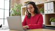 © Krakenimages.com - Young beautiful hispanic woman business worker using laptop working at office