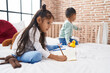 © Krakenimages.com - Adorable boy and girl drawing on notebook playing with duck toy at bedroom