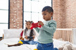 © Krakenimages.com - Adorable boy and girl playing video game sitting on bed at bedroom