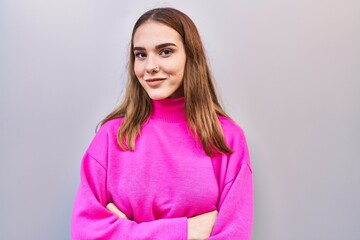 Sticker - Young woman smiling confident standing with arms crossed gesture over isolated white background