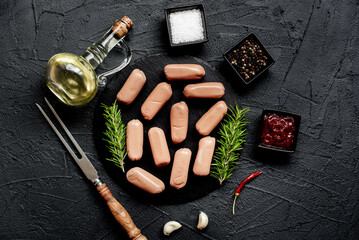 Wall Mural - raw sausages on a stone background