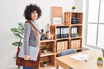 Sticker - Young middle east woman business worker holding briefcase drinking coffee at office