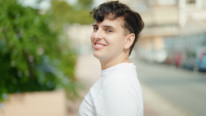 Non binary man smiling confident standing at park