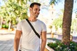 © Krakenimages.com - Young hispanic man smiling confident standing at park
