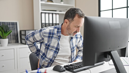 Wall Mural - Middle age man business worker suffering for backache working at office