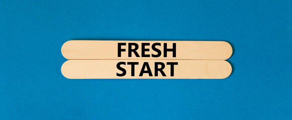 Wall Mural - Fresh start and motivational symbol. Concept words Fresh start on beautiful wooden stick. Beautiful blue table blue background. Business motivational and Fresh start concept. Copy space.