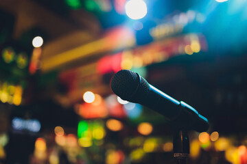 Wall Mural - Close up of microphone in concert hall or conference room.