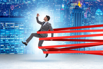 Wall Mural - Businessman being harnessed and restricted