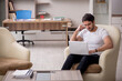 © Elnur - Young male employee working from home during pandemic