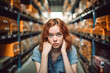 © wetzkaz - young stressed woman, hurry or busy, warehouse and logistic center, job and everyday life at work. Generative AI