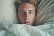 © wetzkaz - young adult man in bed. Generative AI