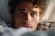 © wetzkaz - young adult man in bed. Generative AI