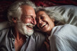 senior couple laughing together in bed, fun and joy, old man grandpa and old woman grandma or mature man and mature woman with gray hair. Generative AI