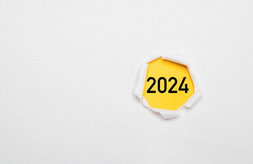 Wall Mural - 2024 year on yellow paper and inside of white punch paper for preparation of merry christmas and hap