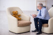 © Elnur - Old male psychologist and soft bear in the room
