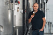 © alexkoral - brewer at a modern brewery with a glass of beer