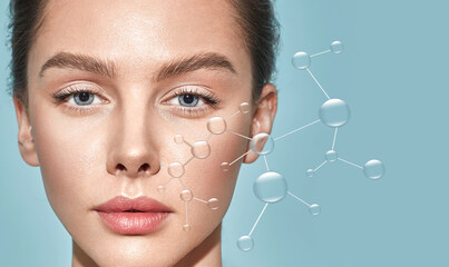 Beauty portrait of Caucasian young woman with healthy facial skin moisturizing her facial skin with drops of water. Concept of cosmetic procedures for skin care