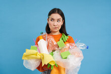 Eco Woman Holding Plastic Bottles And Recycling Waste, Thiking, Looking Confused, Sorting Garbage Into Different Bins, Blue Background