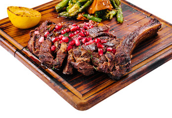 Wall Mural - Sliced grilled pork steak with pomegranate seeds and asparagus