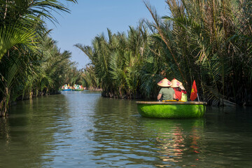  Tourists in basket boats in the coconut forest