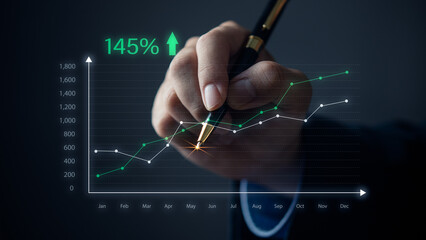 hand holding pen graph virtual screen. Concept marketing investment finance business.