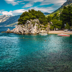 Wall Mural - Moored motorboats in the small bay in Brela, Dalmatia, Croatia