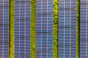 Rows of polycrystalline solar panels. Former farmland or agricultural areas in the countryside used as a solar farm.