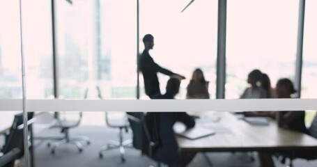 Poster - Silhouette of unknown businesspeople negotiate behind closed doors gathered in modern office conference room. Professional seminar, training event for corporate staff members, brainstorm and teamwork