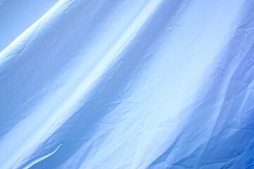White fabric with wrinkles and one background