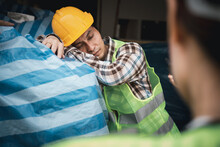 Foreman User Radio To Nurse For First Aid Construction Worker Faint In Construction Site Because Heat Stroke. Worker With Safety Helmet Take A Nap Because So Are Tired From Working In The Hot Sun