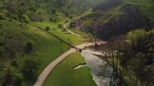 Dovedale Is A Valley In The Peak District Of England. The Land Is Owned By The National Trust And Attracts A Million Visitors Annually. The Valley Was Cut By The River Dove 