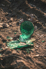  Broken Green Glass Bottle Is Lying On The Ground