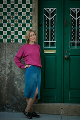 Wall Mural - A woman at the door of a traditional house. Portugal.