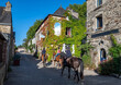 Horse Riding Through Picturesque Village Rochefort En Terre In The Department Of Morbihan In Brittany, France