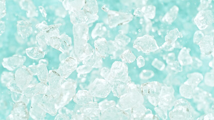 Poster - Freeze motion of flying crushed ice isolated on blue background.