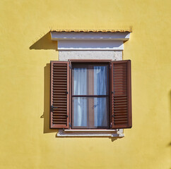 Wall Mural - Traditional window of Italian house with closing doors in wood.