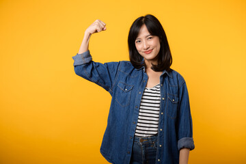 Portrait asian young woman proud and confident showing strong muscle strength arms flexed posing, feels about her success achievement. Women empowerment, equality, healthy strength and courage concept