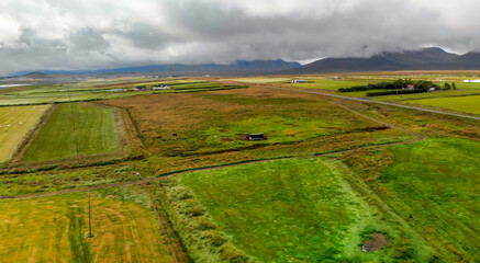 Sticker - Aerial view of Glaumbaer, Iceland. Glaumbaer, in the Skagafjordur district in North Iceland, is a museum featuring a renovated turf farm and timber buildings.