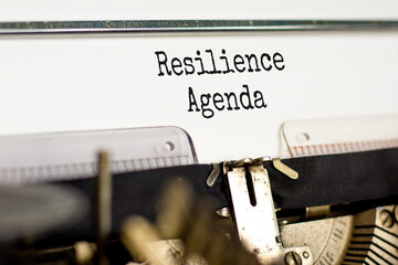 Resilience agenda symbol. Concept word Resilience agenda typed on retro old typewriter. Beautiful white background. Business and resilience agenda concept. Copy space.
