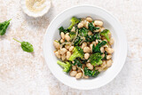 Fototapeta Kawa jest smaczna - White beans stewed with spinach and onion, healthy vegan food, top view