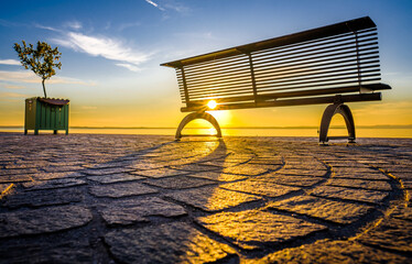 Canvas Print - bench at a lake