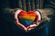 A person holding a rainbow heart in their hands created with Generative AI technology
