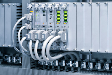 Poster - View of communication port module on PLC unit in control box of automation machine