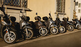 Fototapeta Uliczki - Classic scooters on the narrow streets of Italian city.