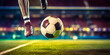 Close up of a soccer striker ready to kicks the ball in the football goal. Soccer scene at night match with player kicking the ball with power
