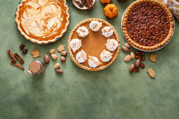 Wall Mural - Traditional Thanksgiving pies with pumpkin pie in the middle